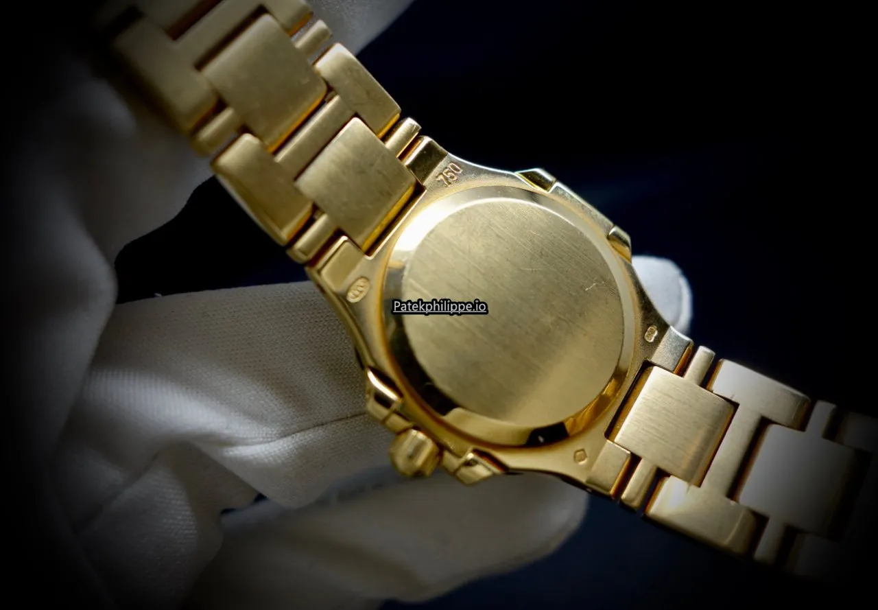 Alternative view of Patek Philippe Nautilus 4700/51j 27x25MM Yellow Gold Case Quartz
